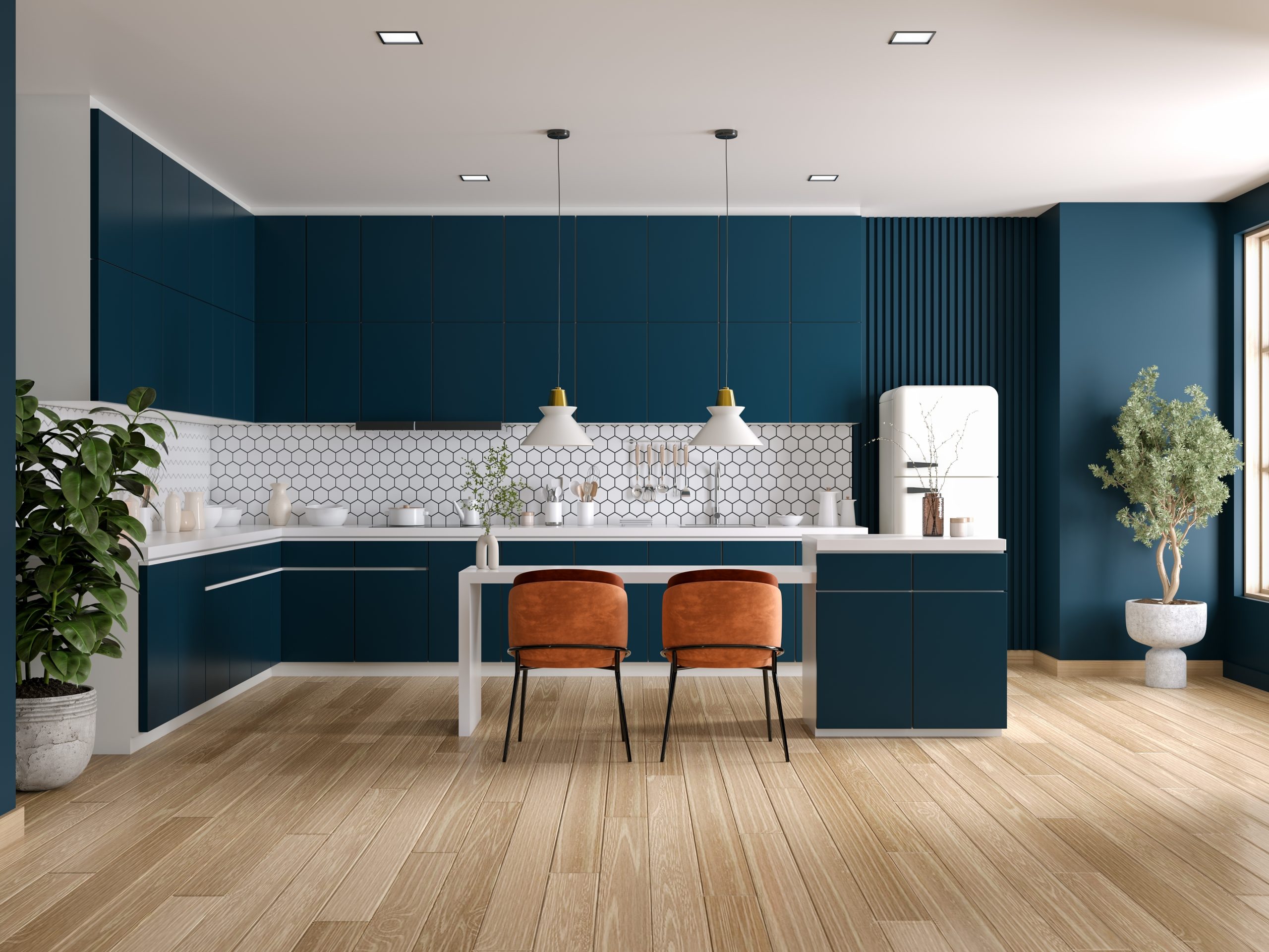 Wood Floor Waxing in Chelsea on ash plank engineered hardwood kitchen floor, showing a smooth satin finish beneath deep-blue cabinets and pendant lights.